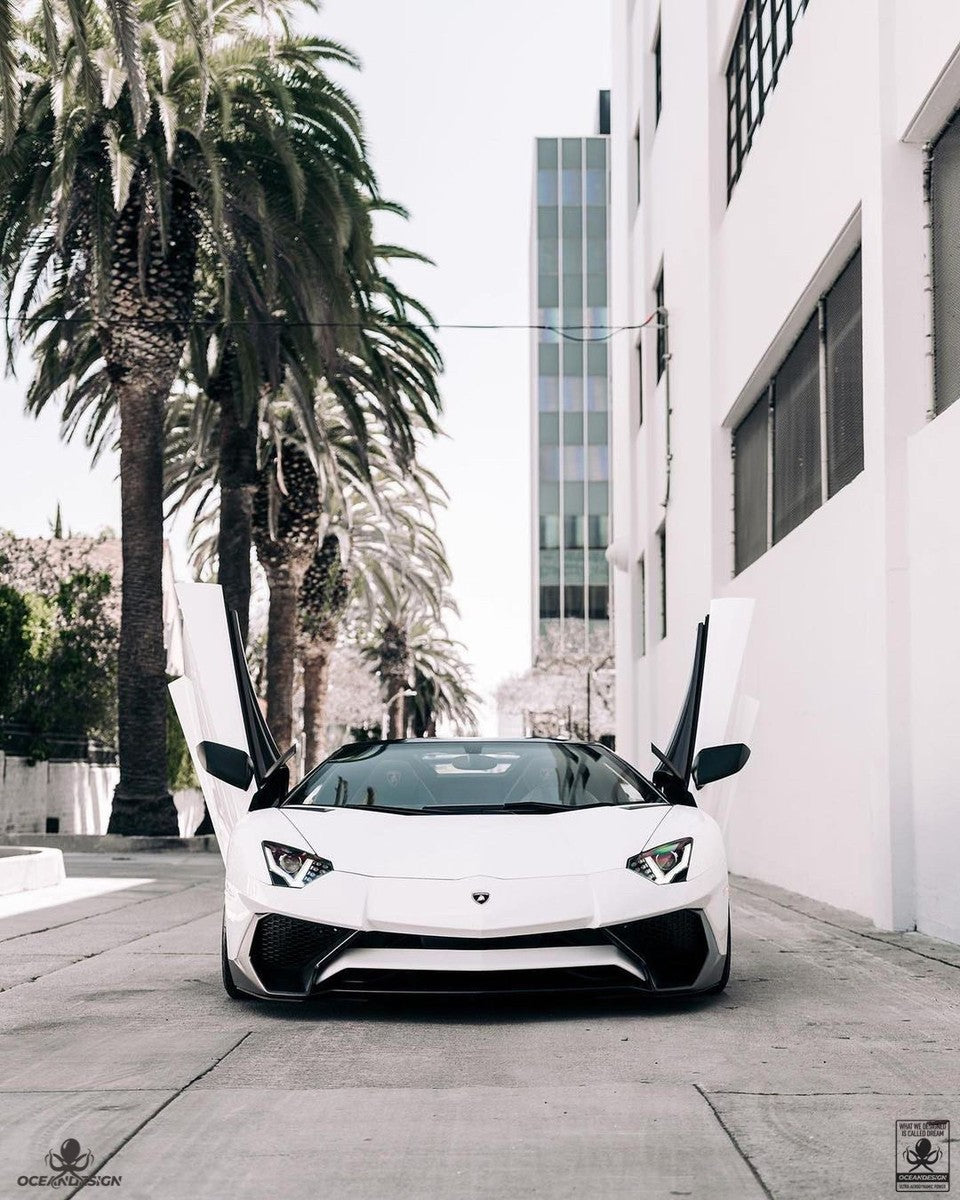 Lamborghini Aventador SV carbon fiber front bumper head-on view doors open